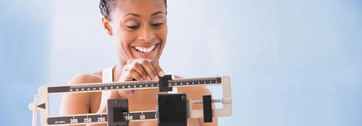 Chiropractic Lancaster PA Weight Loss Woman on Scale Chiropractic Lancaster PA Weight Loss Woman on Scale